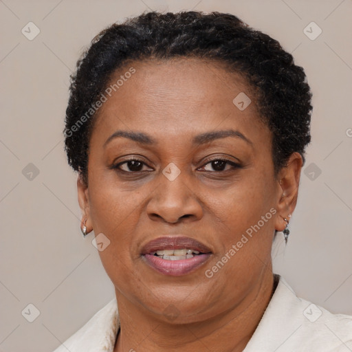 Joyful black adult female with short  brown hair and brown eyes