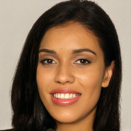 Joyful latino young-adult female with long  black hair and brown eyes