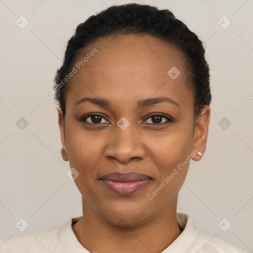 Joyful black young-adult female with short  black hair and brown eyes