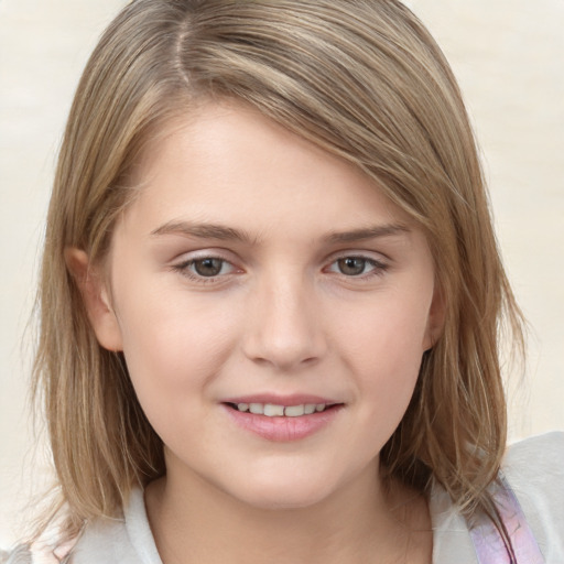 Joyful white child female with medium  brown hair and grey eyes