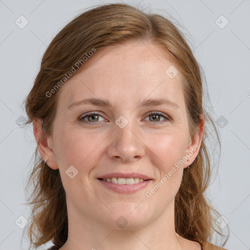 Joyful white young-adult female with medium  brown hair and blue eyes