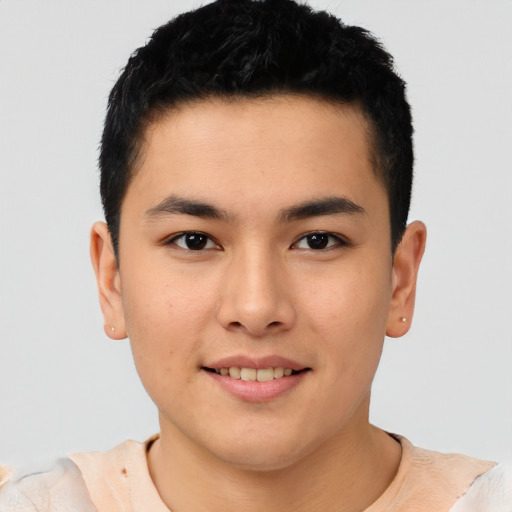 Joyful asian young-adult male with short  brown hair and brown eyes