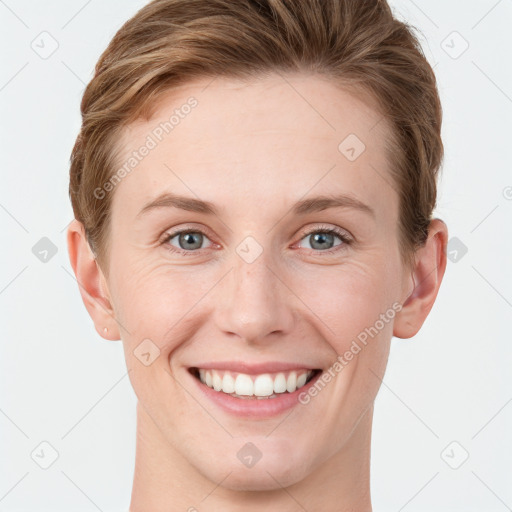 Joyful white young-adult female with short  brown hair and grey eyes