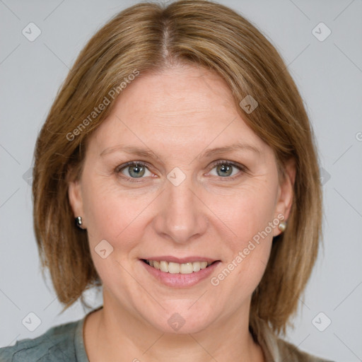 Joyful white adult female with medium  brown hair and blue eyes