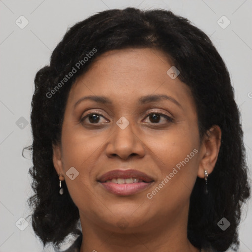 Joyful black adult female with medium  brown hair and brown eyes
