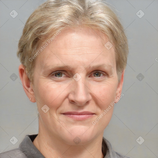 Joyful white adult female with short  brown hair and grey eyes