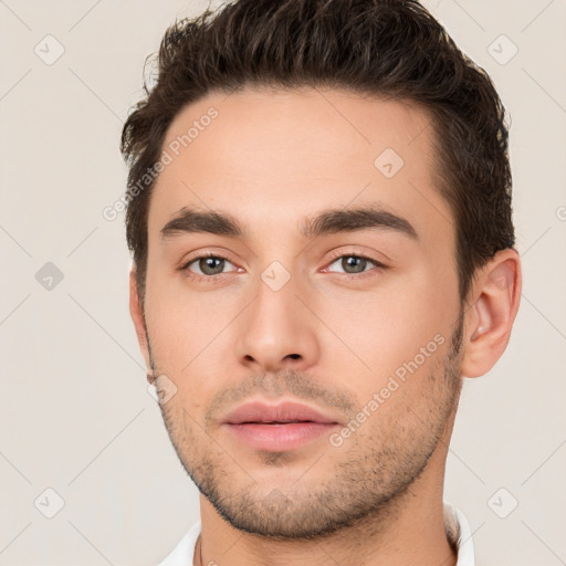 Neutral white young-adult male with short  brown hair and brown eyes