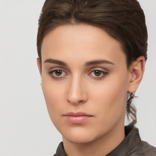 Neutral white young-adult female with short  brown hair and brown eyes