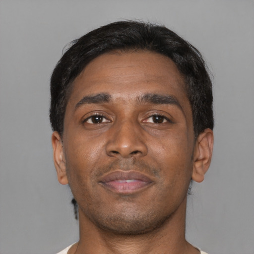 Neutral black young-adult male with short  black hair and brown eyes