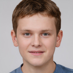 Joyful white child male with short  brown hair and grey eyes