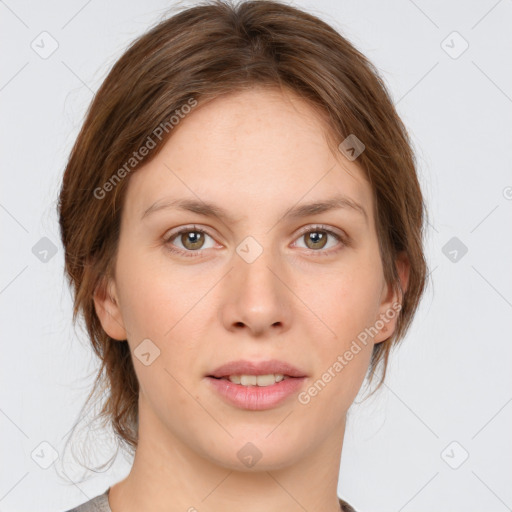 Joyful white young-adult female with medium  brown hair and green eyes