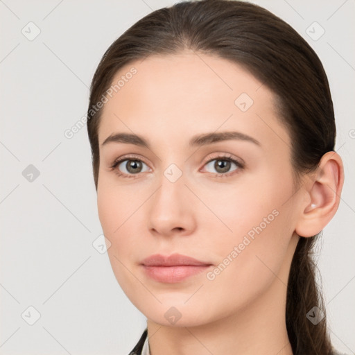 Neutral white young-adult female with long  brown hair and brown eyes