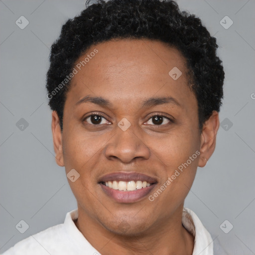 Joyful black adult female with short  brown hair and brown eyes