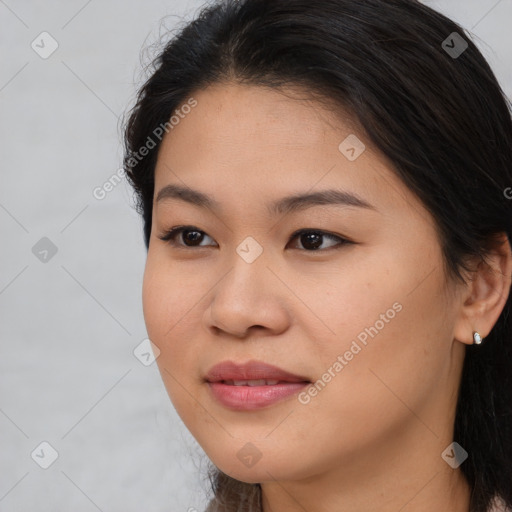 Joyful asian young-adult female with long  brown hair and brown eyes