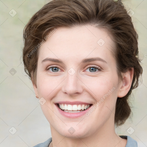 Joyful white young-adult female with medium  brown hair and green eyes