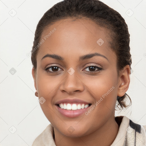 Joyful latino young-adult female with short  brown hair and brown eyes