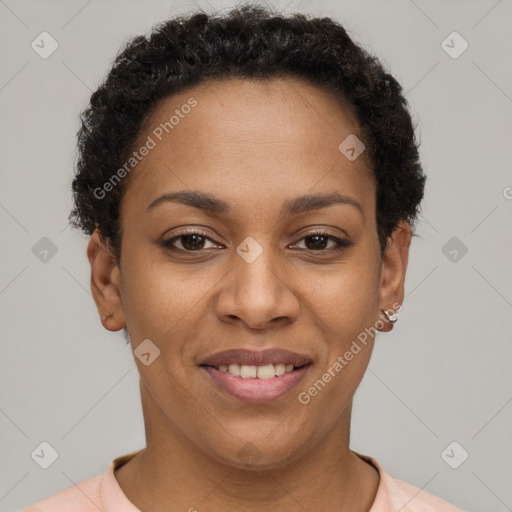 Joyful black young-adult female with short  brown hair and brown eyes