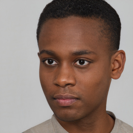 Neutral black young-adult male with short  brown hair and brown eyes