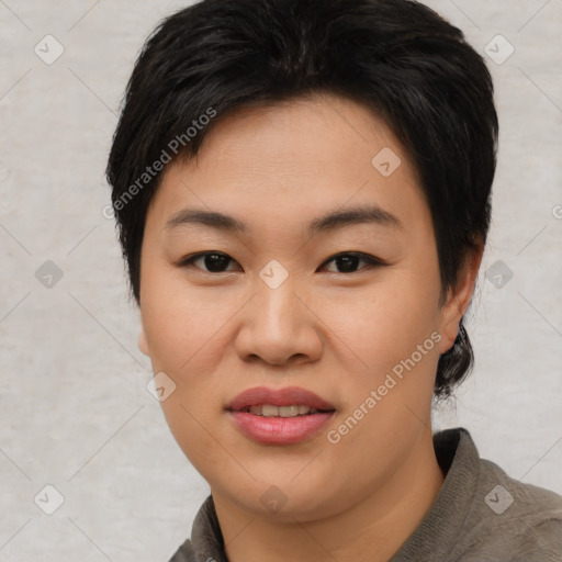 Joyful asian young-adult female with short  brown hair and brown eyes