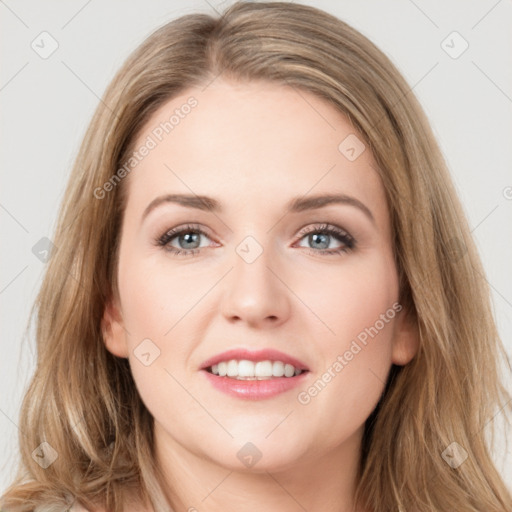 Joyful white young-adult female with long  brown hair and green eyes