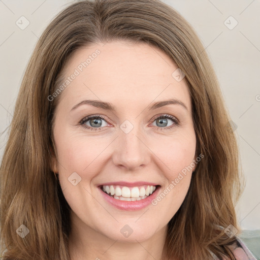 Joyful white young-adult female with long  brown hair and green eyes