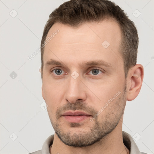 Neutral white young-adult male with short  brown hair and brown eyes