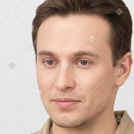 Joyful white young-adult male with short  brown hair and brown eyes