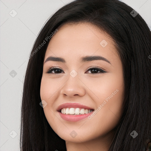 Joyful white young-adult female with long  black hair and brown eyes