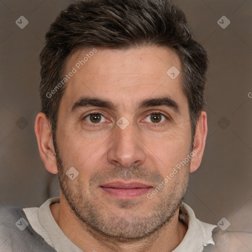 Joyful white adult male with short  brown hair and brown eyes