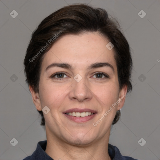 Joyful white adult female with short  brown hair and brown eyes