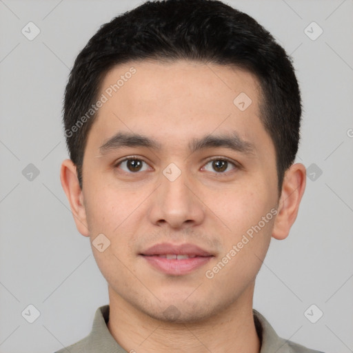 Joyful white young-adult male with short  black hair and brown eyes