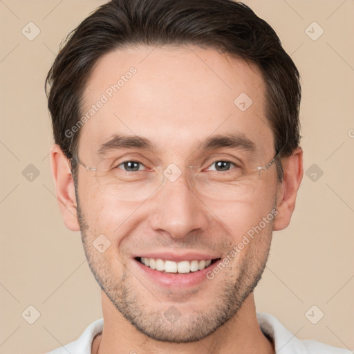 Joyful white adult male with short  brown hair and brown eyes