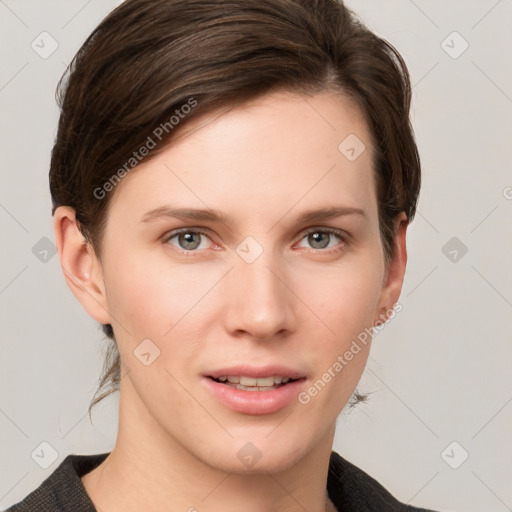 Joyful white young-adult female with short  brown hair and grey eyes