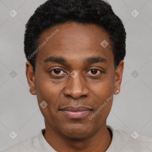 Joyful black young-adult male with short  black hair and brown eyes