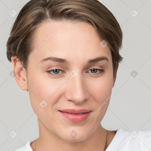 Joyful white young-adult female with short  brown hair and grey eyes