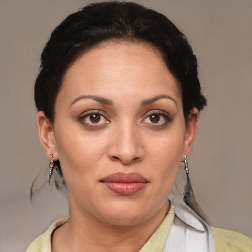 Joyful latino young-adult female with short  brown hair and brown eyes