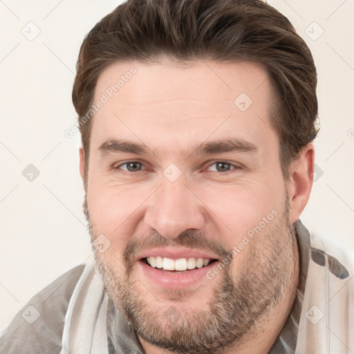 Joyful white young-adult male with short  brown hair and brown eyes