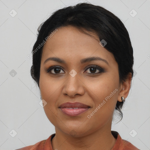 Joyful latino young-adult female with medium  black hair and brown eyes