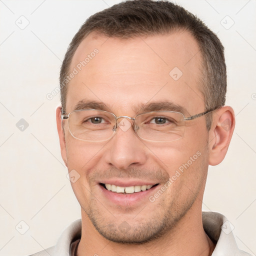 Joyful white adult male with short  brown hair and brown eyes