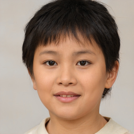 Joyful asian child female with short  brown hair and brown eyes