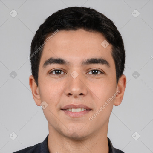 Joyful white young-adult male with short  black hair and brown eyes