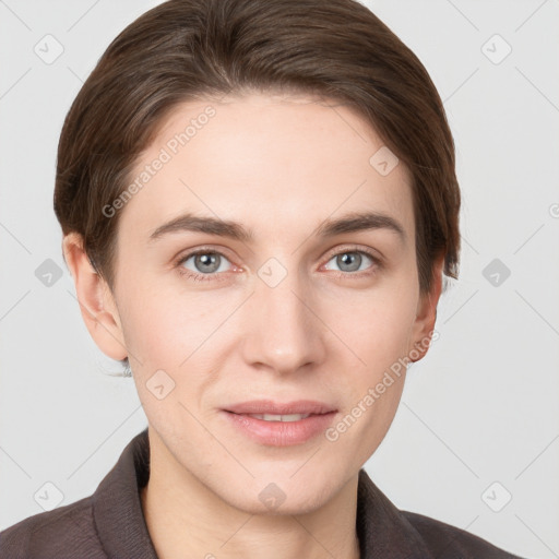 Joyful white young-adult female with short  brown hair and grey eyes