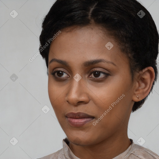 Joyful latino young-adult female with short  black hair and brown eyes