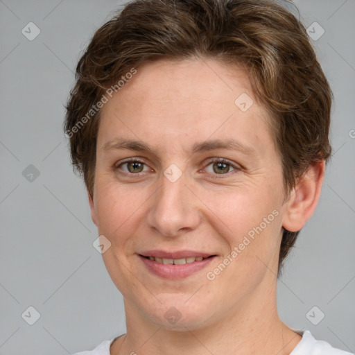 Joyful white adult female with short  brown hair and brown eyes