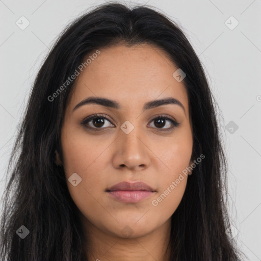 Joyful latino young-adult female with long  brown hair and brown eyes