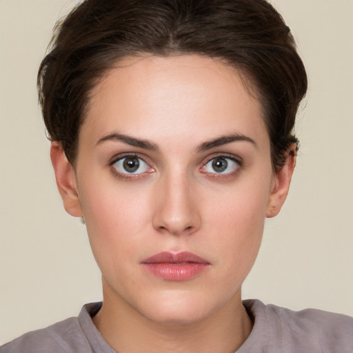 Neutral white young-adult female with short  brown hair and brown eyes