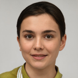 Joyful white young-adult female with short  brown hair and brown eyes