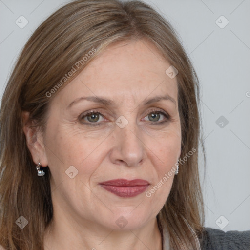 Joyful white adult female with long  brown hair and grey eyes