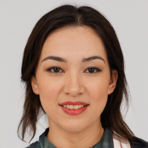 Joyful asian young-adult female with medium  brown hair and brown eyes