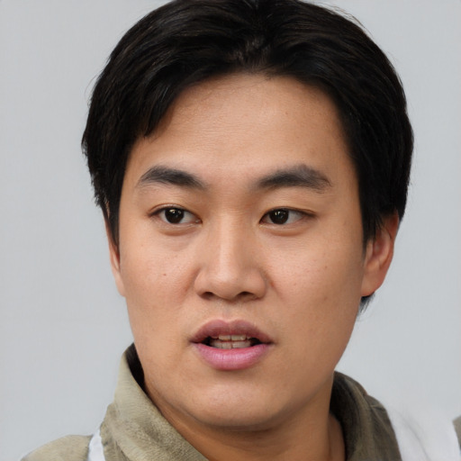 Neutral asian young-adult male with short  black hair and brown eyes